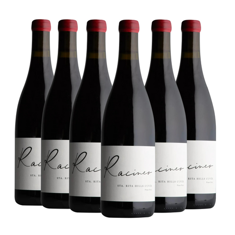 Six bottles of Racines wine with red bottle caps on a white background