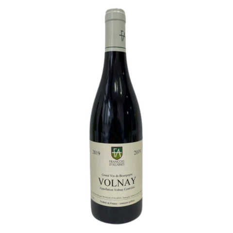 Wine bottle labeled 'Volnay' on a white background